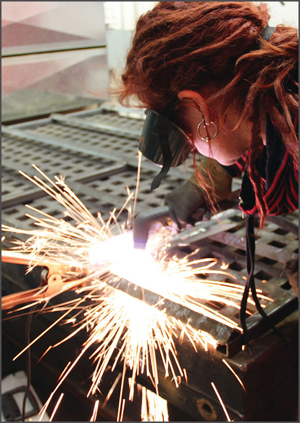 image of a woman welding