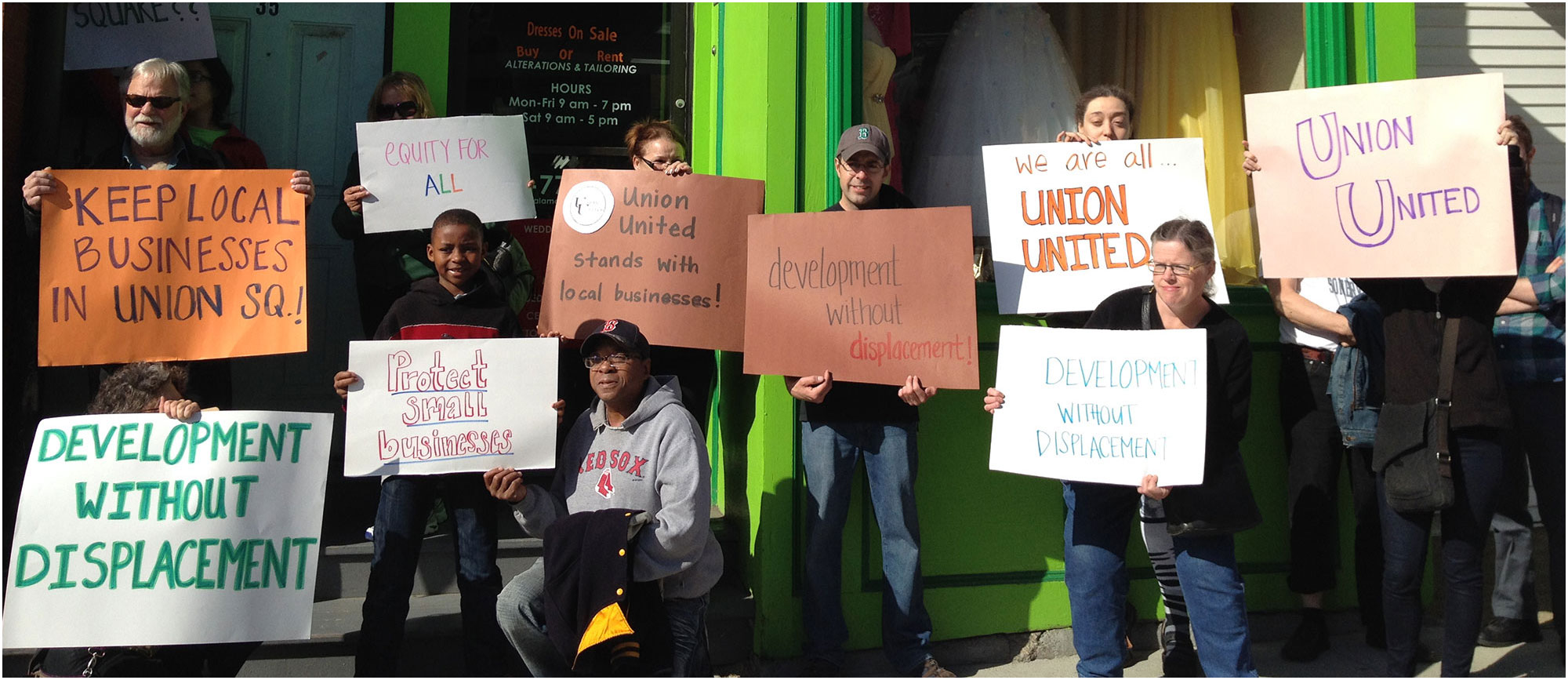 image of demonstrators holding a banner