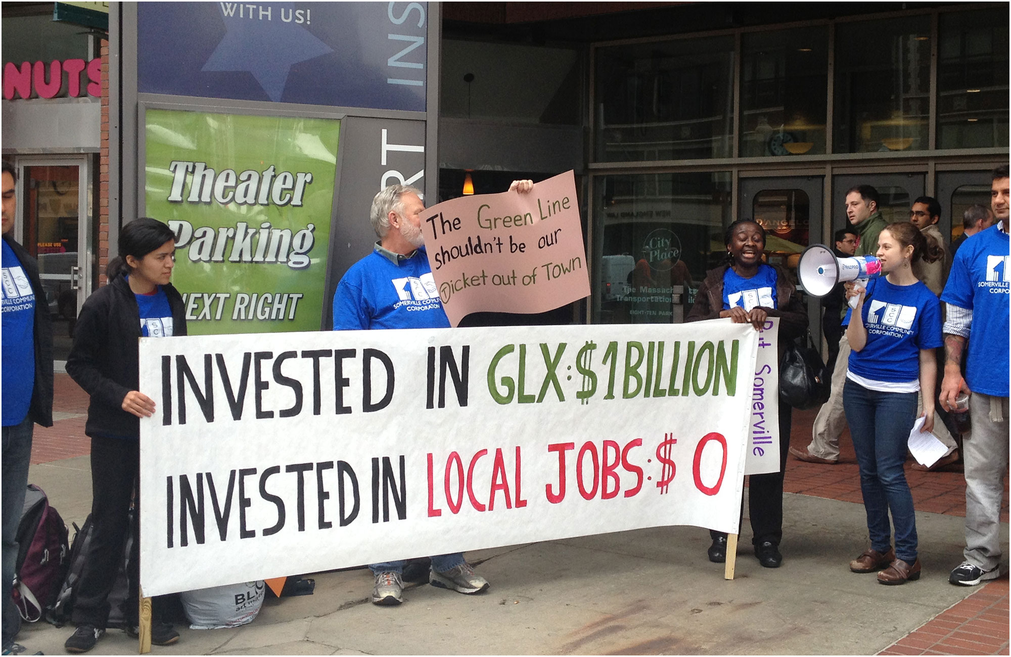 image of demonstrators holding a banner